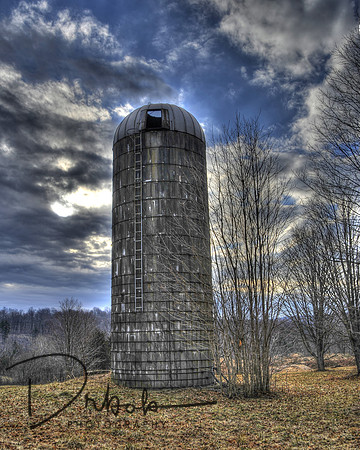 SIlo near an abandoned home